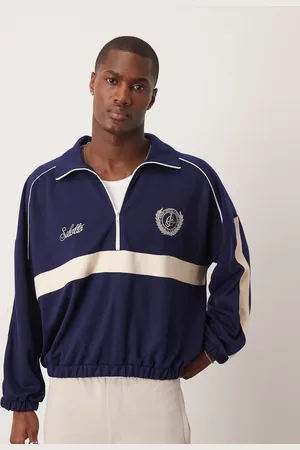 ASOS Jersey extragrande de corte cuadrado con hombros caídos, media cremallera y estampado en el pecho de