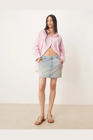 ASOS Minifalda vaquera con tapeta de botones y bolsillo de parche de