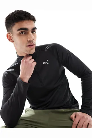 PUMA Top negro con cremallera corta Tech de
