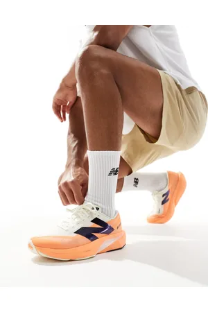 New Balance Zapatillas de deporte naranjas Fuelcell Rebel V4 de Running