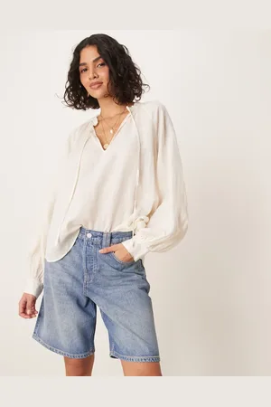 Free People Pantalones cortos vaqueros azules de corte alargado con detalles desgastados Montana de
