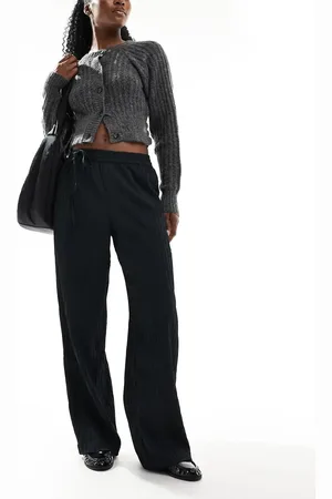 AWARE Pantalones negros holgados de tejido texturizado de