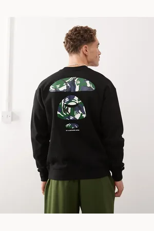 A Bathing Ape Sudadera negra básica con logo y estampado de camuflaje en la espalda de