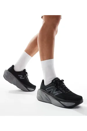 New Balance Zapatillas de deporte negras y blancas More de Running