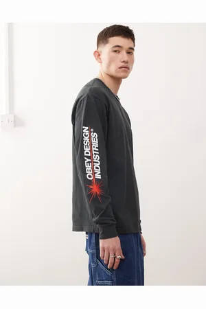 Obey Camiseta negro vintage auténtico de manga larga con estampado gráfico del logo y texto "Design Industries" de