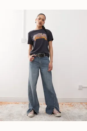 Wrangler Vaqueros de corte suelto con abertura delantera y lavado azul vintage de tejido ligero de