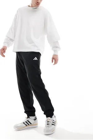 adidas Pantalones negros y blancos con logo pequeño Stanford de adidas Essentials