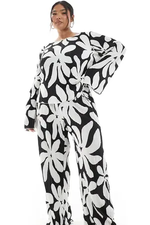 VERO MODA Pantalones monocromáticos plisados de pernera ancha y talle alto con estampado floral de -Negro