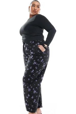 ASOS Pantalones de sastre negros de pernera arqueada con patrón floral de jacquard de Curve