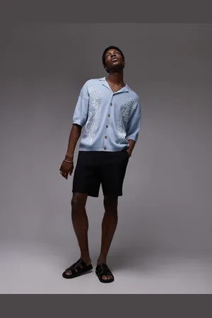 Topman Polo azul con solapas y bordado floral en los laterales de