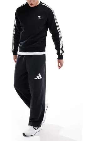 adidas Pantalones negros de pernera ancha con logo de 3 bandas Essentials de