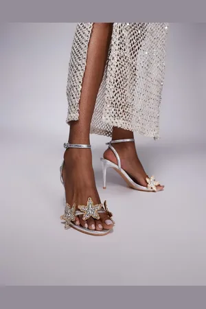 Public Desire Sandalias plateadas de tacón alto con diseño de estrellas de mar adornadas de