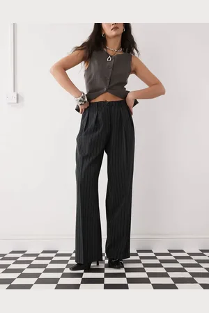 Motel Pantalones negros con raya diplomática y pinzas Syra de