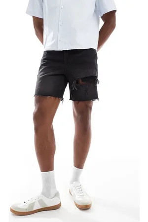 ASOS Pantalones cortos vaqueros de largo medio y corte slim con lavado negro y diseño rasgado de