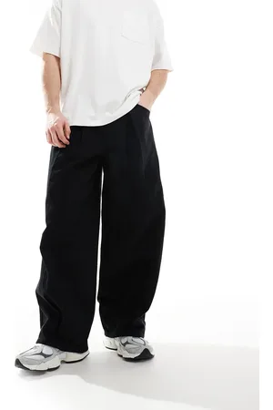 ASOS Pantalones negros muy holgados con pliegues de