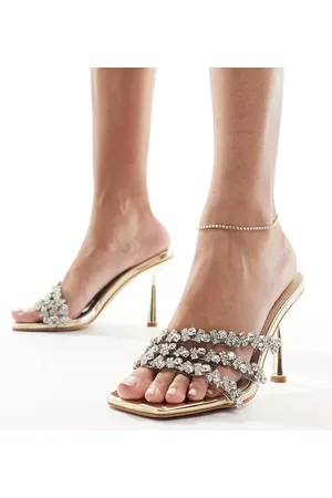 Simmi London Sandalias doradas estilo mules de tacón con diseño de tiras adornadas Messina de SIMMI London Wide Fit