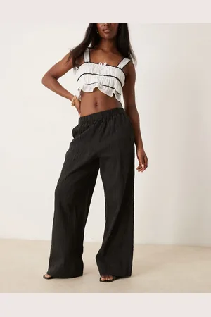 SELECTED Pantalones negros sueltos con patrón texturizado de Femme