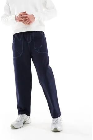 ASOS Pantalones holgados con pespuntes en contraste de nailon de