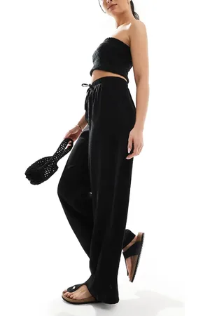 New Look Pantalones negros de pernera ancha de tejido efecto rugoso de
