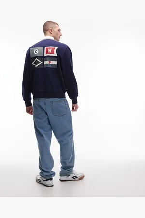 Carhartt Sudadera estilo polo de rugby con estampado de banderas de