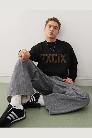 ASOS Sudadera negra extragrande con estampado de letras de guepardo de
