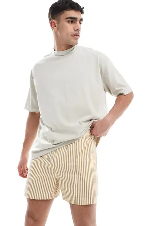 ASOS Pantalones muy cortos a rayas amarillas y blancas de corte ancho de
