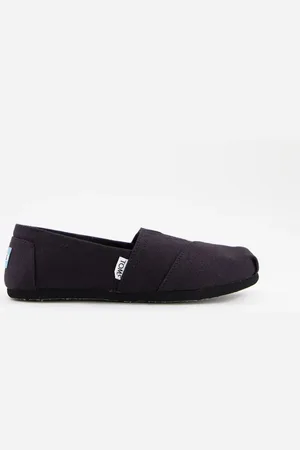 TOMS Zapatos con suela negra de lona Alpargata de