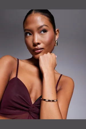 Aldo Pulsera dorada rígida sin cierres con detalles de ojo turco Safelove de -Dorado