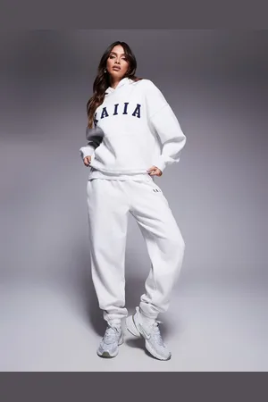 Kaiia Joggers claro jaspeado con bajo ajustado y logo bordado de (parte de un conjunto)