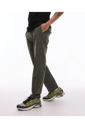 MANGO Pantalones de corte slim de tejido deportivo transpirable de