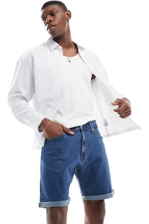 JJ Pantalones cortos vaqueros azules con lavado medio y bajos vueltos de