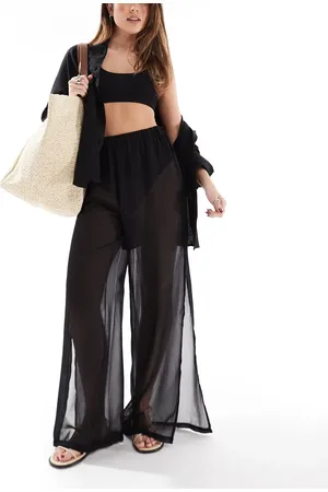 Threadbare Pantalones playeros negros de pernera ancha con abertura lateral de tejido transparente de
