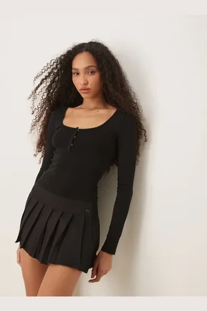 Gina Tricot Top de manga larga con tapeta de botones oculta en la parte delantera de punto liso de
