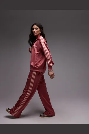 adidas Pantalones de chándal rosas sueltos Firebird exclusivos en ASOS de