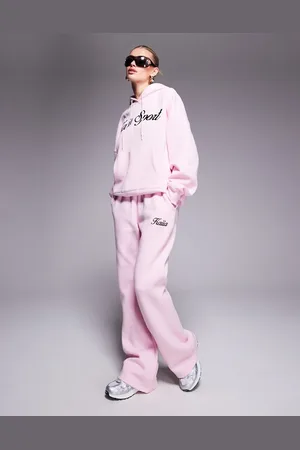 Kaiia Joggers rosas y negros con logo de texto bordado de (parte de un conjunto)