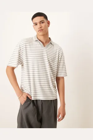 ASOS Polo blanco a rayas azules de corte cuadrado extragrande con logo en el pecho de canalé de