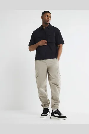 River Island Pantalones cargo color medio con bajos ajustados de -Neutro