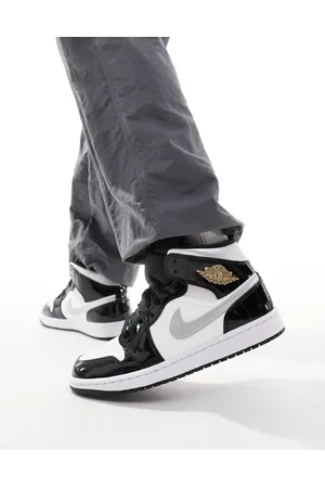 Jordan Zapatillas de deporte blancas, negras y plateadas Air 1 Mid de Nike