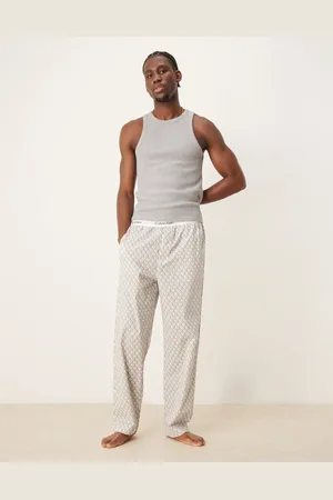 Calvin Klein Pantalones de pijama beis con estampado de monograma de algodón de -Gris