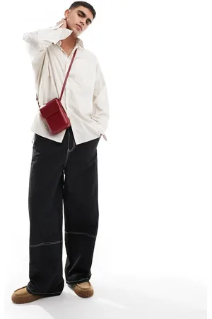 ASOS Pantalones negros holgados con pespuntes en contraste de nailon de