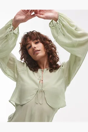 MANGO Top verde pálido con lazada delantera de estilo capa de