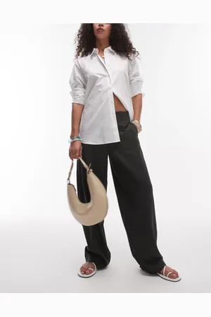 Topshop Pantalones de talle medio y corte tapered globo con cinturilla lisa de