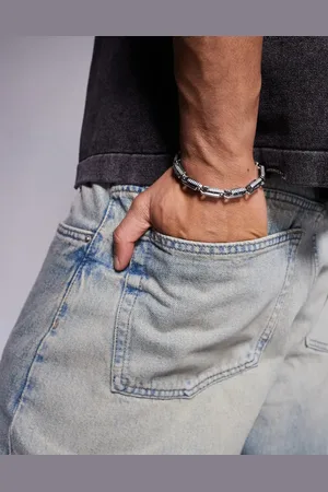 ASOS Pulsera gruesa plateada con detalles en relieve de acero inoxidable resistente al agua de