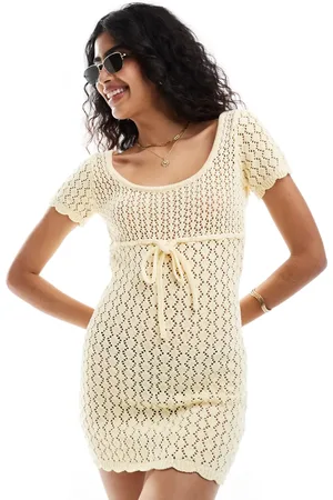 The Frolic Vestido playero corto limón con espalda al aire y detalle de lazada de croché Mango de