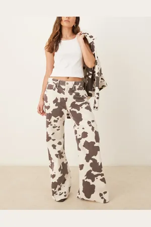 Abercrombie & Fitch Vaqueros multicolores de corte bootcut holgado y talle medio con estampado de vaca de