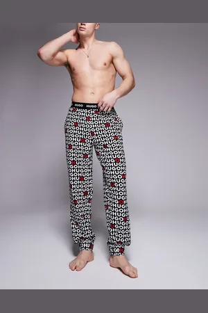 HUGO BOSS Pantalones negros con estampado integral del logo Tortuga de HUGO Bodywear
