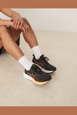 Asics Zapatillas de deporte negras y naranja neón para correr Gel-Pulse 16 de