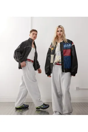 COLLUSION Joggers jaspeado de pernera ancha con cinturilla doble de Unisex