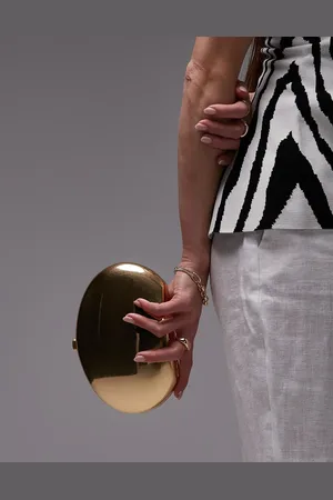 MANGO Clutch metalizado ovalado de