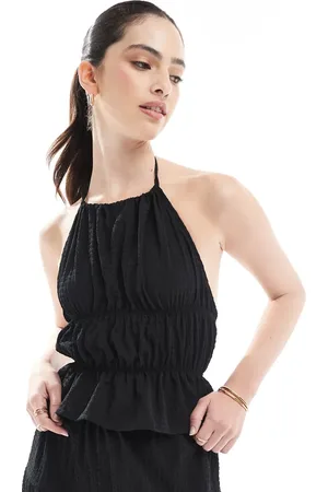 Esmée Top playero con cuello halter y espalda al aire de tejido texturizado transparente exclusivo de (parte de un conjunto)